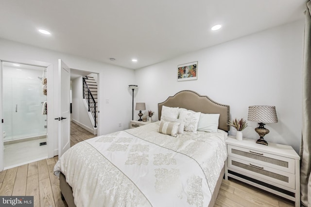bedroom with light wood finished floors, visible vents, and recessed lighting
