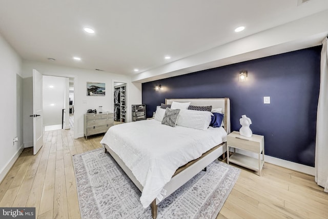bedroom featuring recessed lighting and light wood-style floors