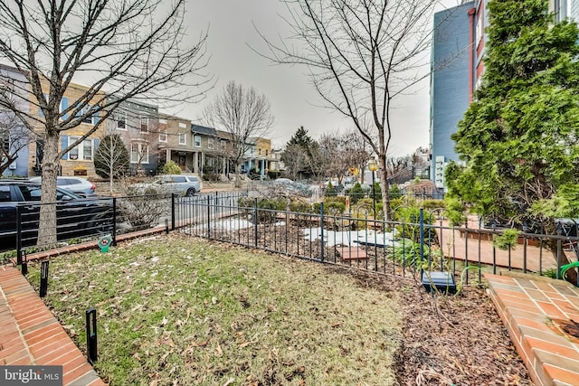 view of yard with fence and a residential view