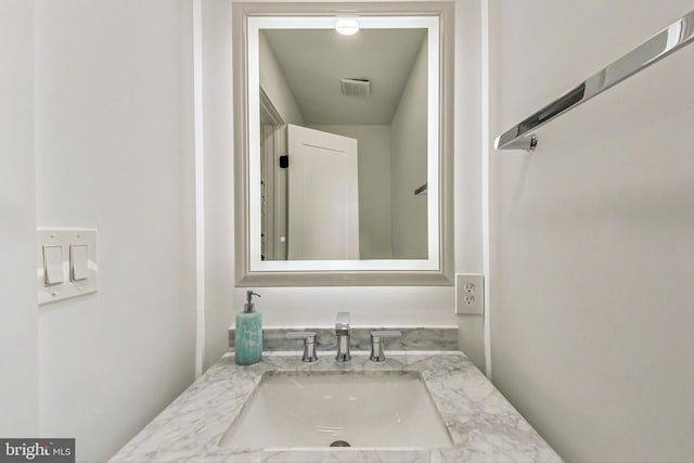 bathroom featuring vanity and visible vents