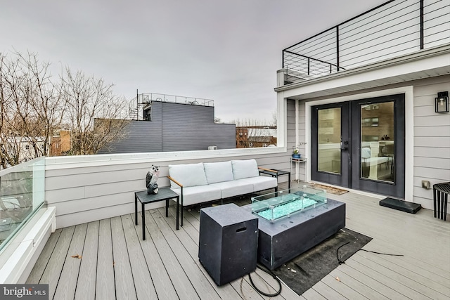 wooden deck featuring outdoor lounge area