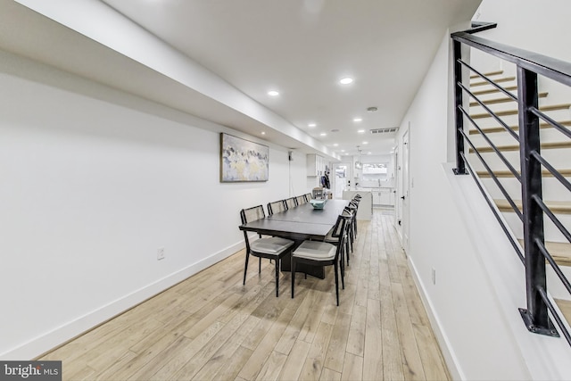 dining space with visible vents, baseboards, stairs, light wood-style floors, and recessed lighting