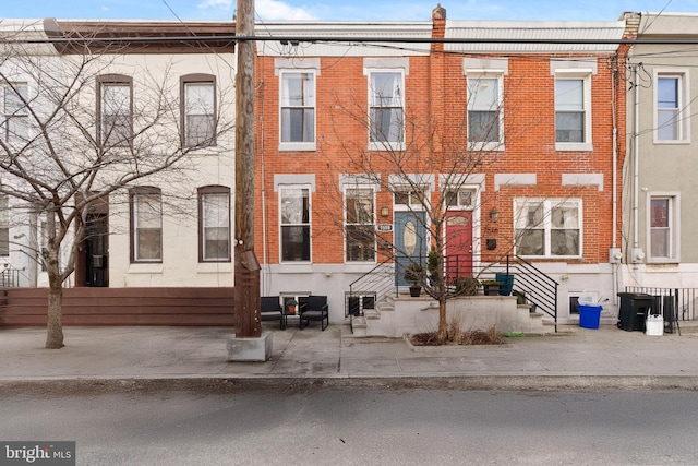 townhome / multi-family property with brick siding