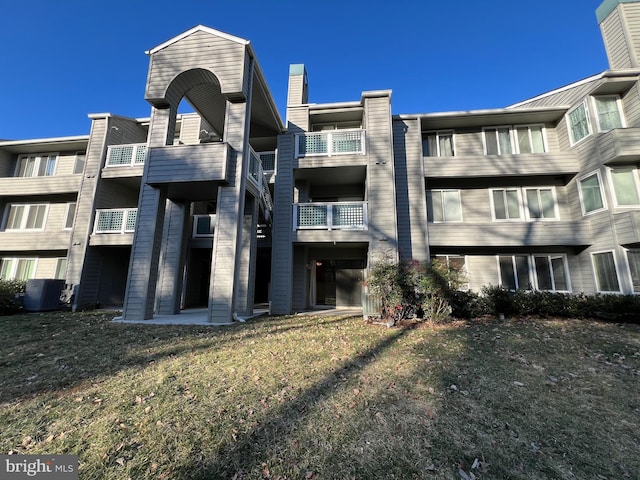 view of building exterior with cooling unit