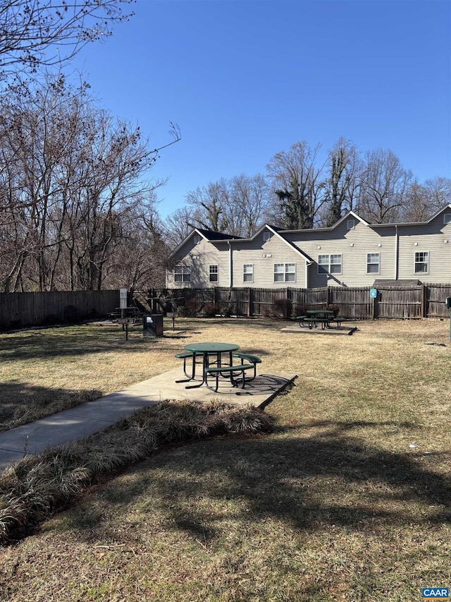 exterior space featuring fence and a yard