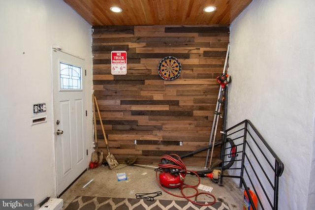 interior space featuring recessed lighting, wood ceiling, and wood walls