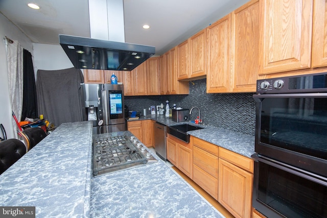 kitchen with recessed lighting, island range hood, stainless steel appliances, a sink, and tasteful backsplash