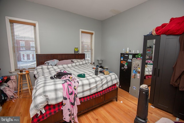 bedroom with light wood-style floors