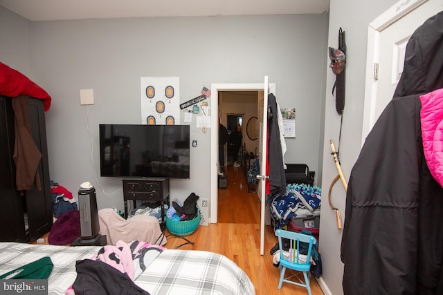 bedroom with wood finished floors