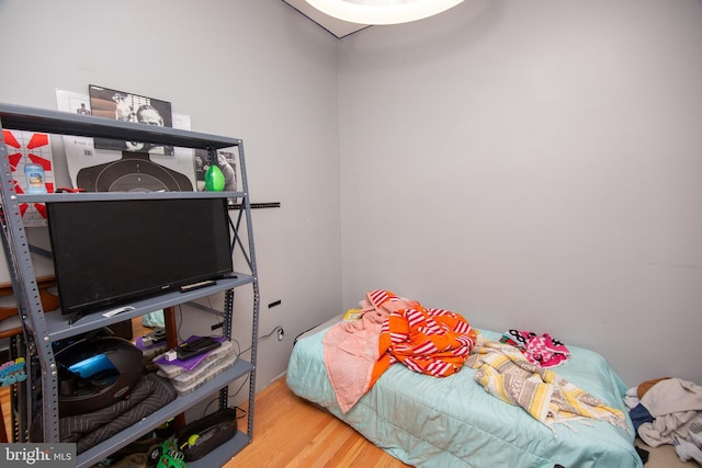 bedroom with wood finished floors