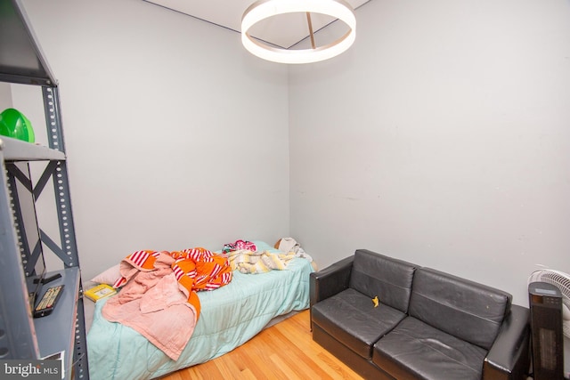 bedroom with wood finished floors