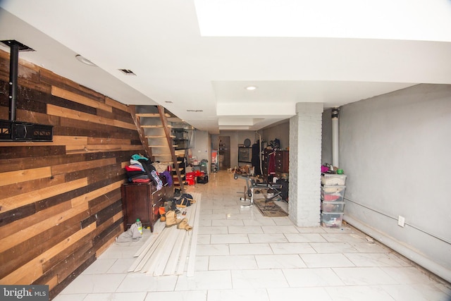 interior space with visible vents and wooden walls