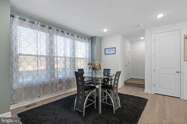 dining area with recessed lighting, visible vents, baseboards, and wood finished floors