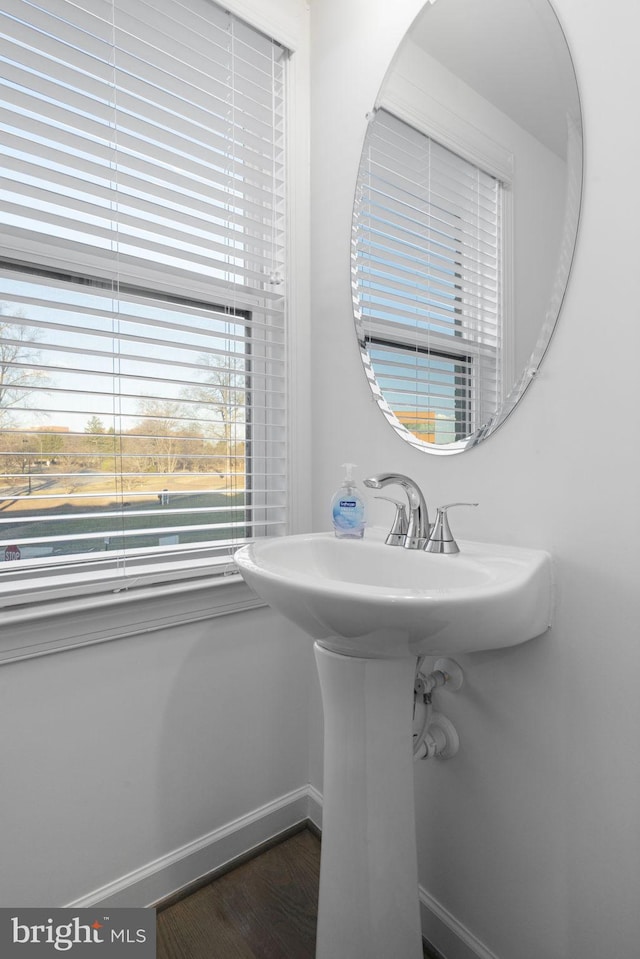 bathroom featuring baseboards and wood finished floors