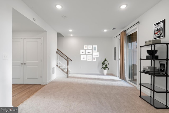 interior space with baseboards, stairs, visible vents, and recessed lighting