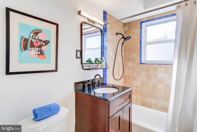 full bathroom featuring toilet, shower / bath combination with curtain, and vanity