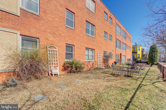 view of property with fence