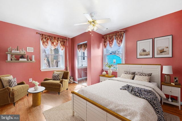 bedroom with a ceiling fan and wood finished floors