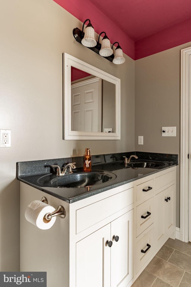 bathroom with a sink and double vanity