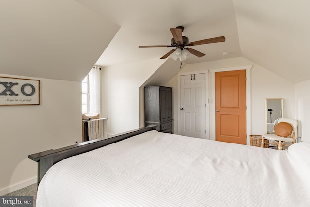 bedroom featuring lofted ceiling, ceiling fan, carpet floors, and baseboards