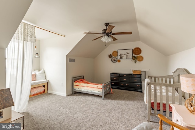 bedroom featuring vaulted ceiling, carpet, visible vents, and baseboards