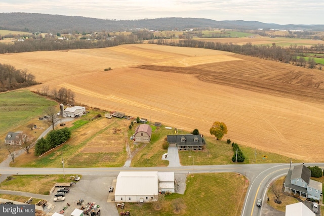 drone / aerial view featuring a rural view and a mountain view