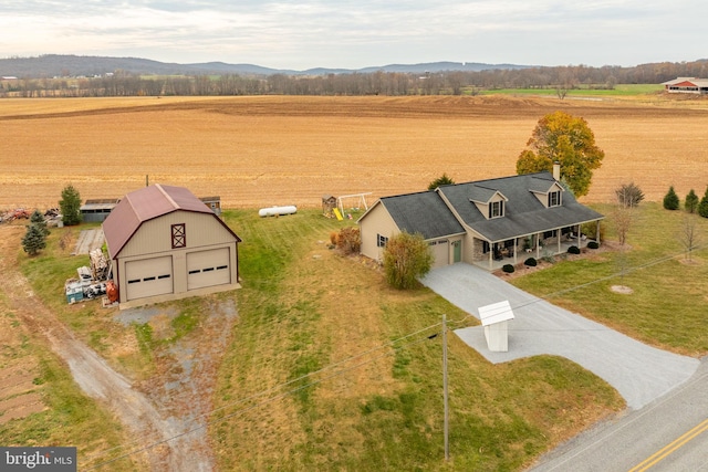 bird's eye view with a rural view and a mountain view