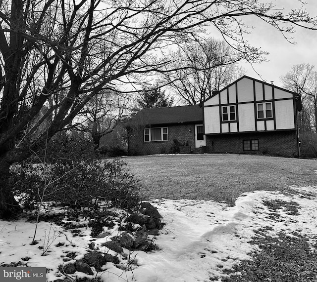 view of front of property featuring brick siding