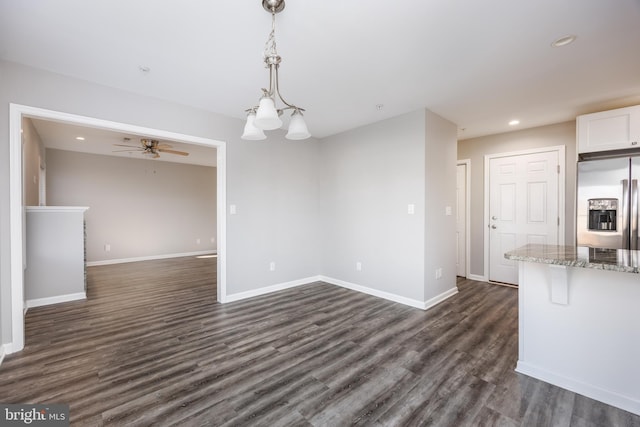 unfurnished dining area with a ceiling fan, recessed lighting, baseboards, and dark wood-style flooring