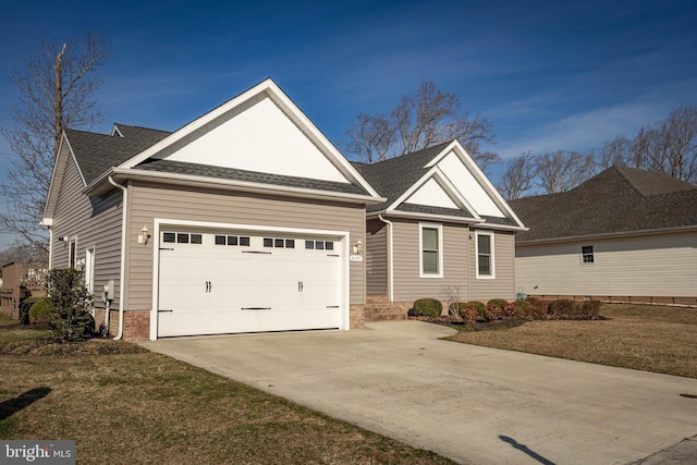 view of front of home featuring concrete driveway, an attached garage, and a shingled roof