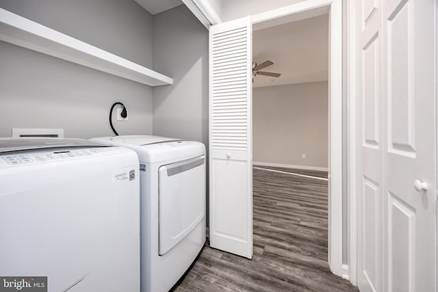 laundry room featuring dark wood-type flooring, baseboards, ceiling fan, laundry area, and washing machine and clothes dryer