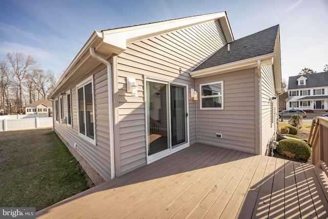 deck with a yard and fence