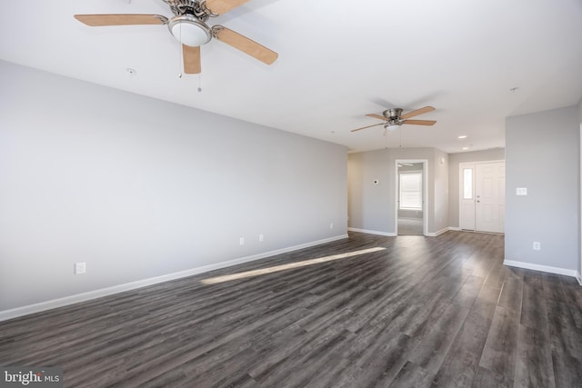 empty room featuring recessed lighting, baseboards, dark wood-style floors, and a ceiling fan