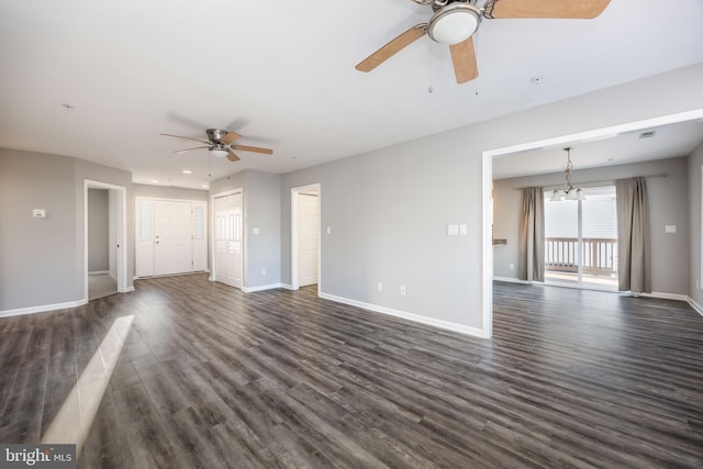 unfurnished living room with baseboards, dark wood-style floors, and ceiling fan with notable chandelier