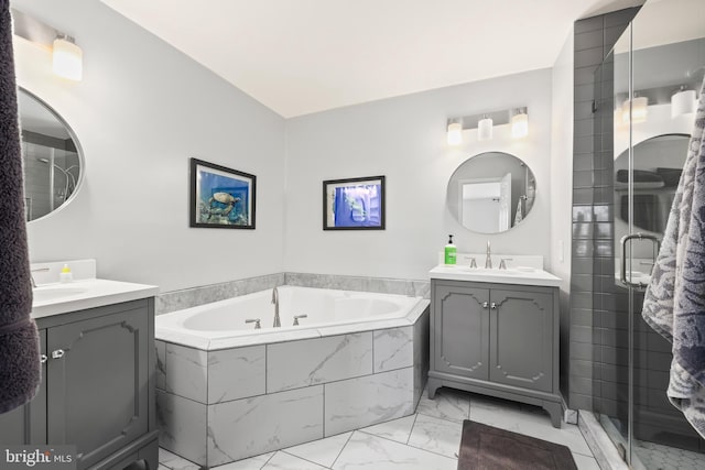 full bathroom featuring two vanities, a sink, marble finish floor, a shower stall, and a bath