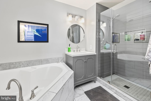 full bath featuring a garden tub, marble finish floor, a shower stall, and vanity