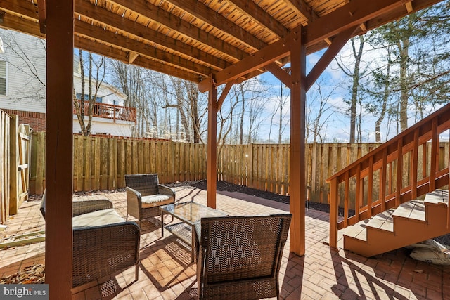 view of patio featuring outdoor lounge area and a fenced backyard