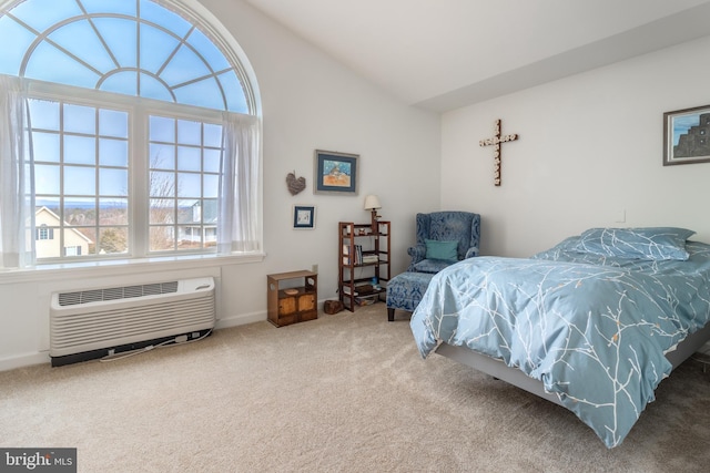 305 Village Heights Dr Unit 325, State College, PA 16801 - carpeted bedroom featuring a wall unit AC, baseboards, and lofted ceiling