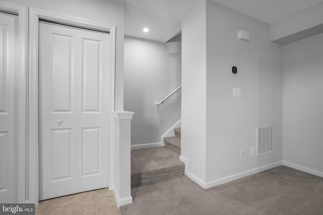 stairs featuring carpet, recessed lighting, visible vents, tile patterned flooring, and baseboards