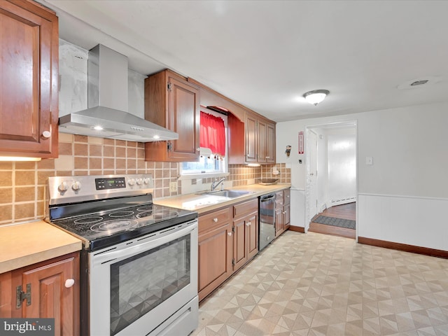 kitchen with electric range, a sink, light countertops, wall chimney range hood, and dishwasher