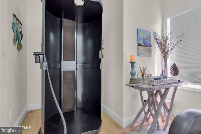 interior space with light wood-style flooring and baseboards