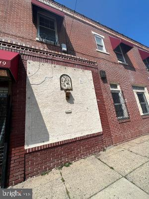 view of side of property with brick siding