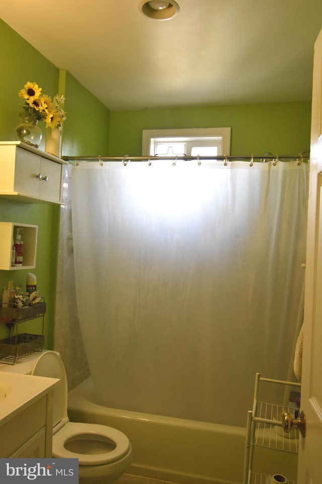 full bathroom with toilet, shower / bath combination with curtain, and vanity