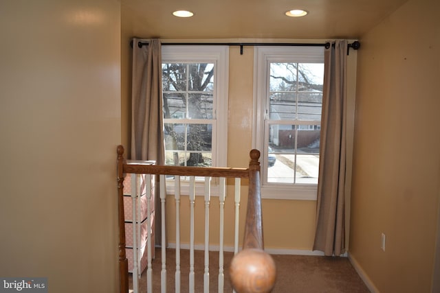 doorway to outside featuring carpet floors, recessed lighting, and baseboards