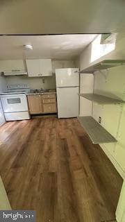 kitchen featuring white appliances, white cabinets, under cabinet range hood, and dark wood-style flooring