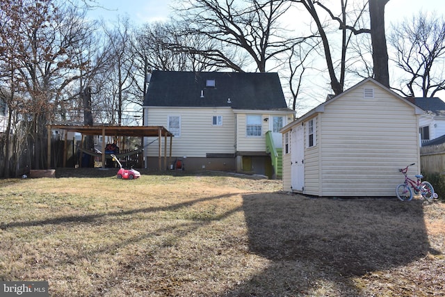 back of house featuring a yard