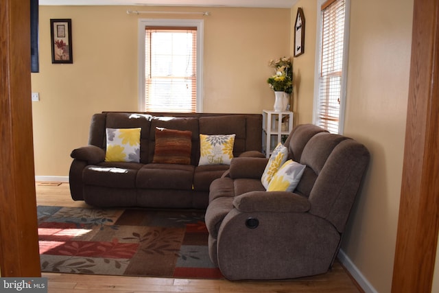 living room with wood finished floors and baseboards