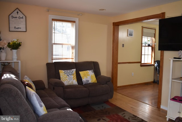 living room featuring wood finished floors and baseboards