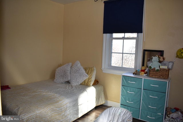 bedroom with wood finished floors