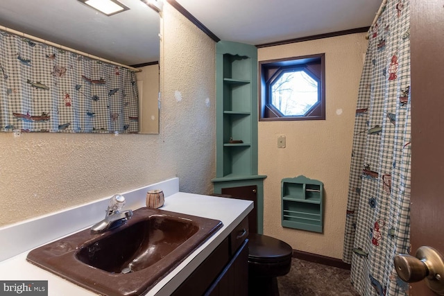 full bath featuring a textured wall and ornamental molding